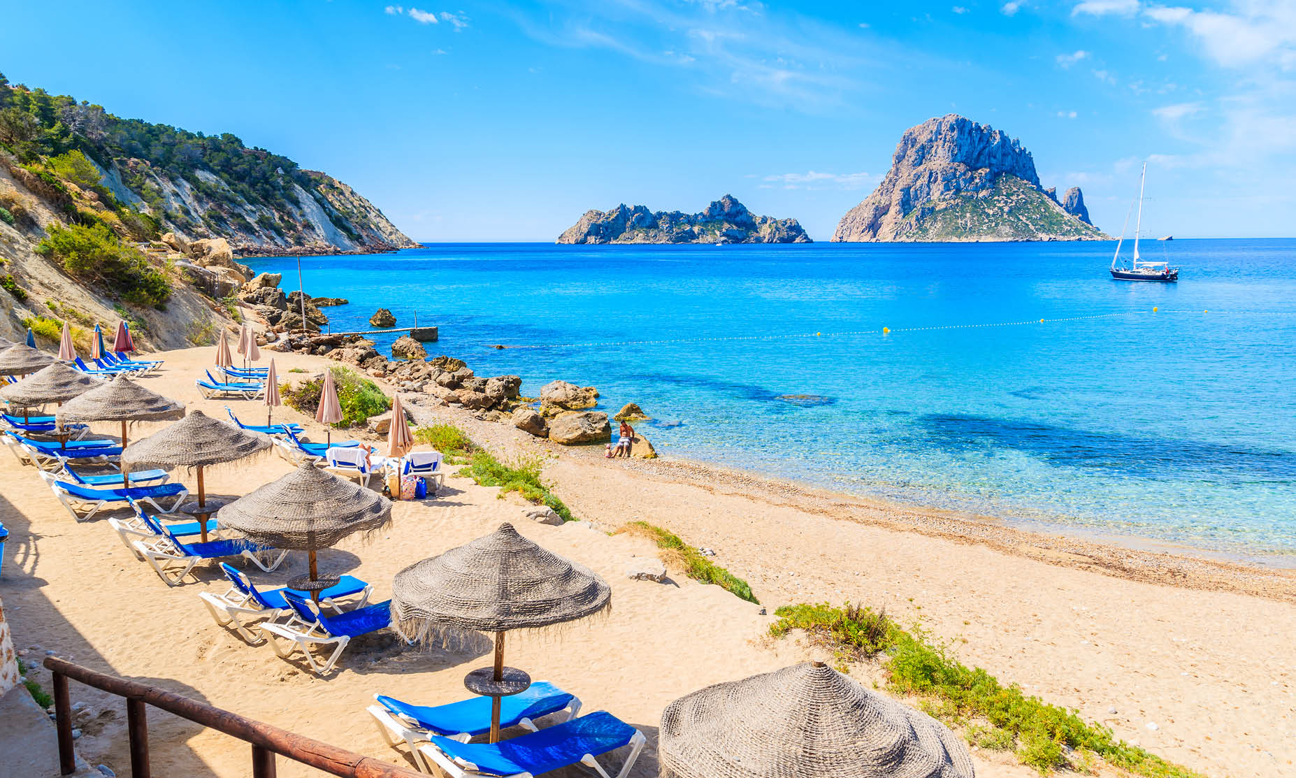 Picture yourself relaxing in the clear waters of Cala d'hort Beach, Ibiza