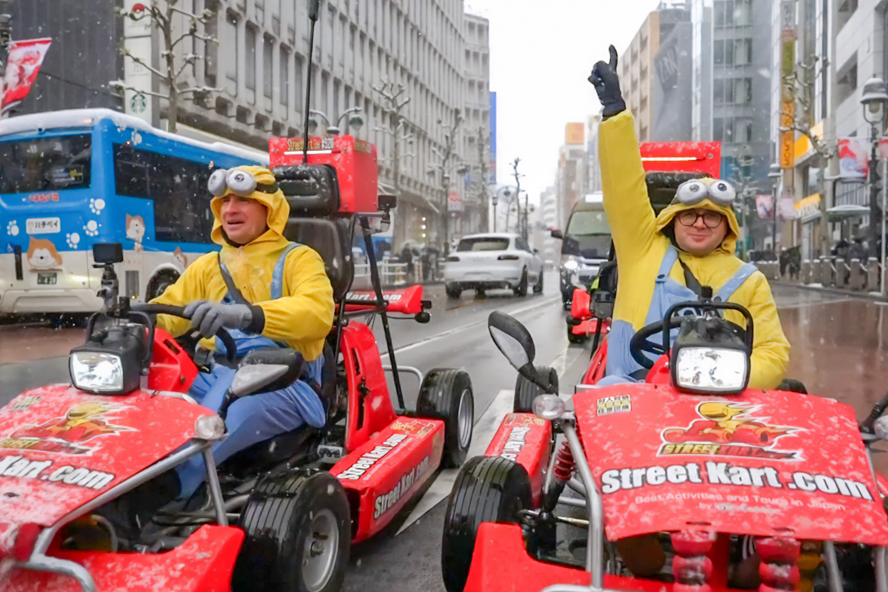 Sunrise's weather man Sam Mac (left) and his producer karting through Shibuya on a snowy day.